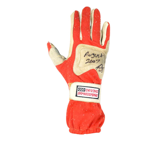 Red and beige driving glove with 'Driving Impressions' logo on a white background