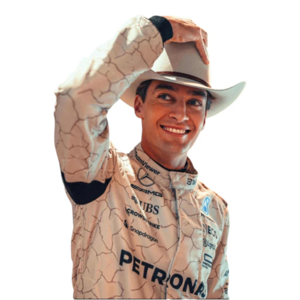 Person wearing a racing suit with sponsor logos, raising one arm in a gesture.