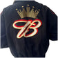 Black jacket with a prominent logo on the back against a white background