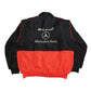 Black and red jacket with McLaren and Mercedes-Benz logos on a white background