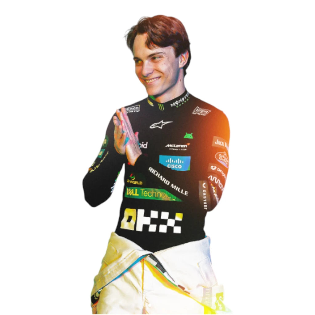 Cardboard cutout of a person wearing a racing suit with various sponsor logos on a white background