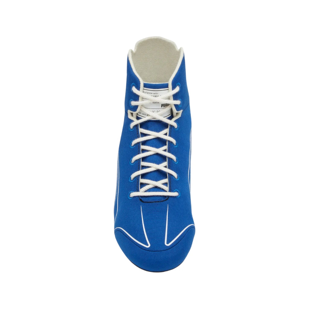 Blue sneaker with white laces on a white background