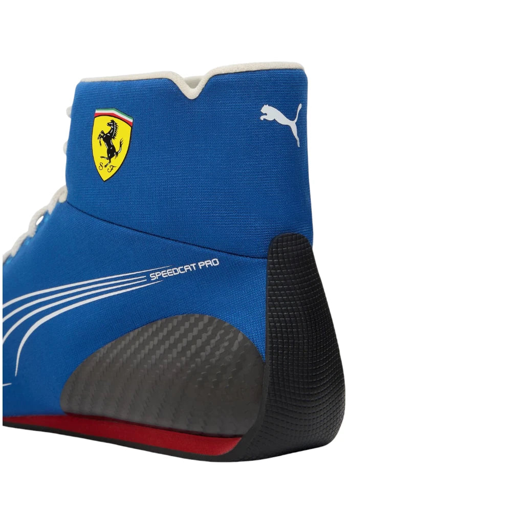 Blue racing boot with Ferrari and Puma logos on a white background