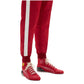 Red tracksuit with white stripes and red shoes on a white background