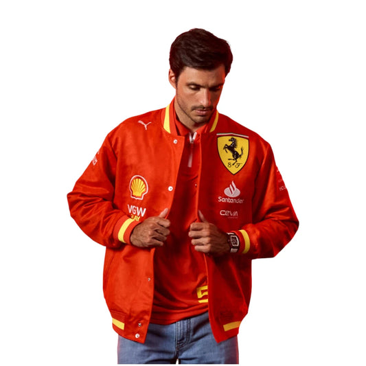 Man wearing a red jacket with various logos on a white background