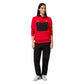 Person wearing a red and black tracksuit with a logo on a white background