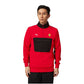 Person wearing a red and black sports jacket with a logo on a white background