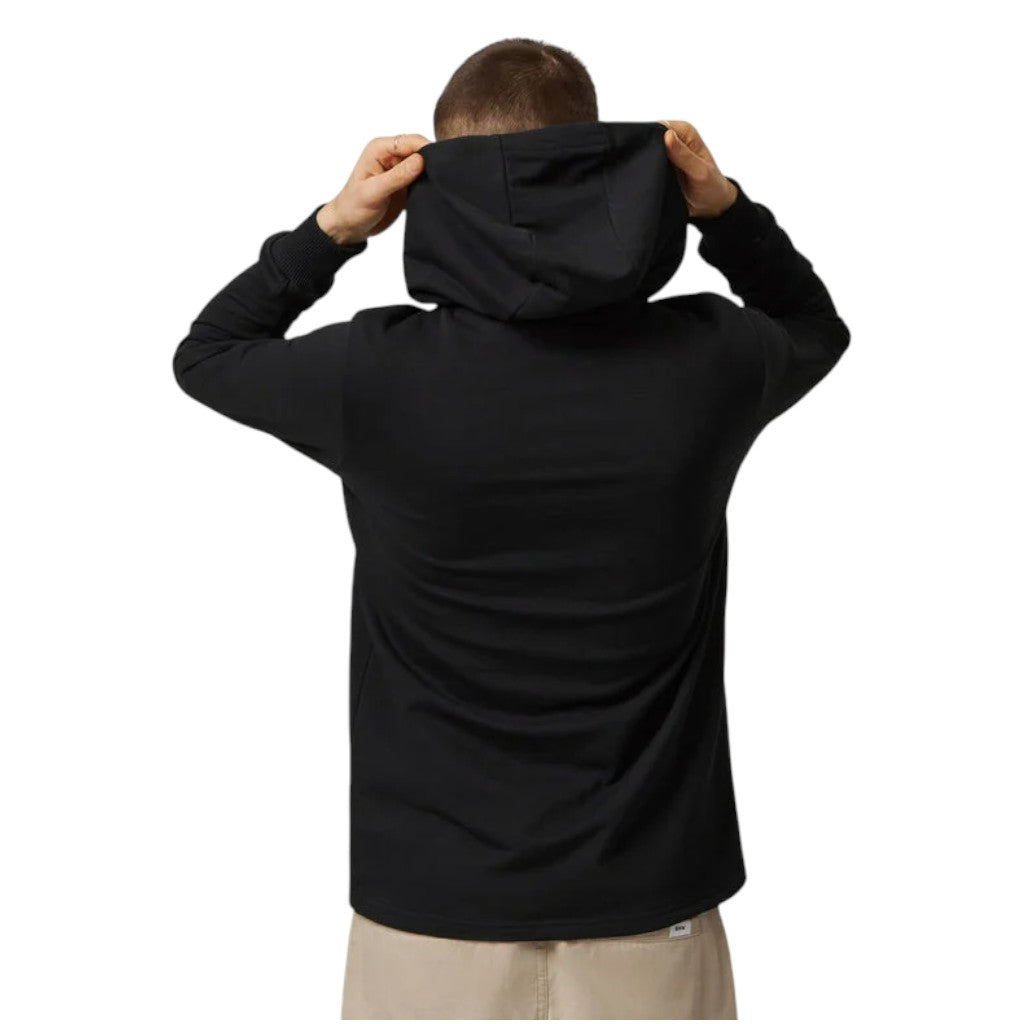 Person wearing a black hoodie from behind on a white background