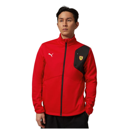 Person wearing a red and black jacket with a logo on a white background