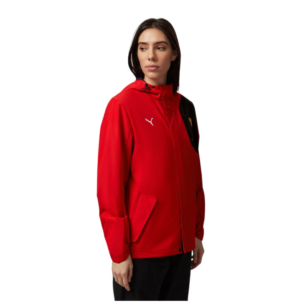 Person wearing a red jacket with a brand logo on a white background
