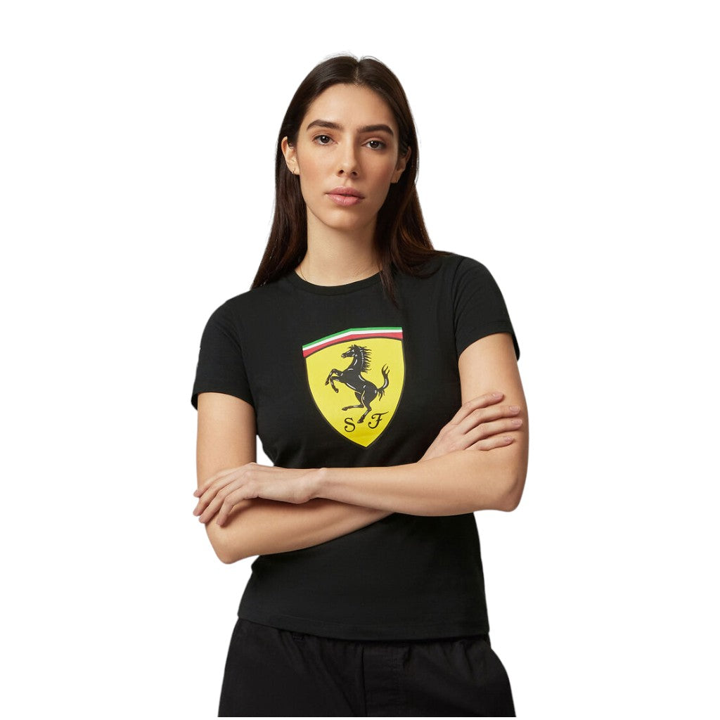 Woman wearing a black t-shirt with a Ferrari logo on a white background