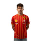 Person wearing a red sports jersey with various sponsor logos on a white background