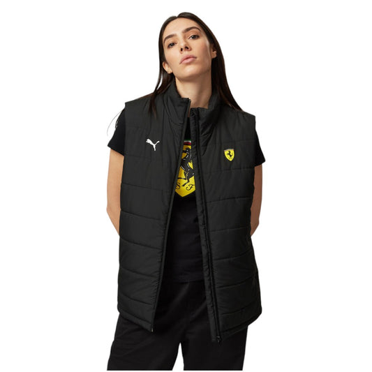 Woman wearing a black puffer vest with a logo on a white background