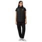 Woman wearing a black vest with a logo and matching pants on a white background