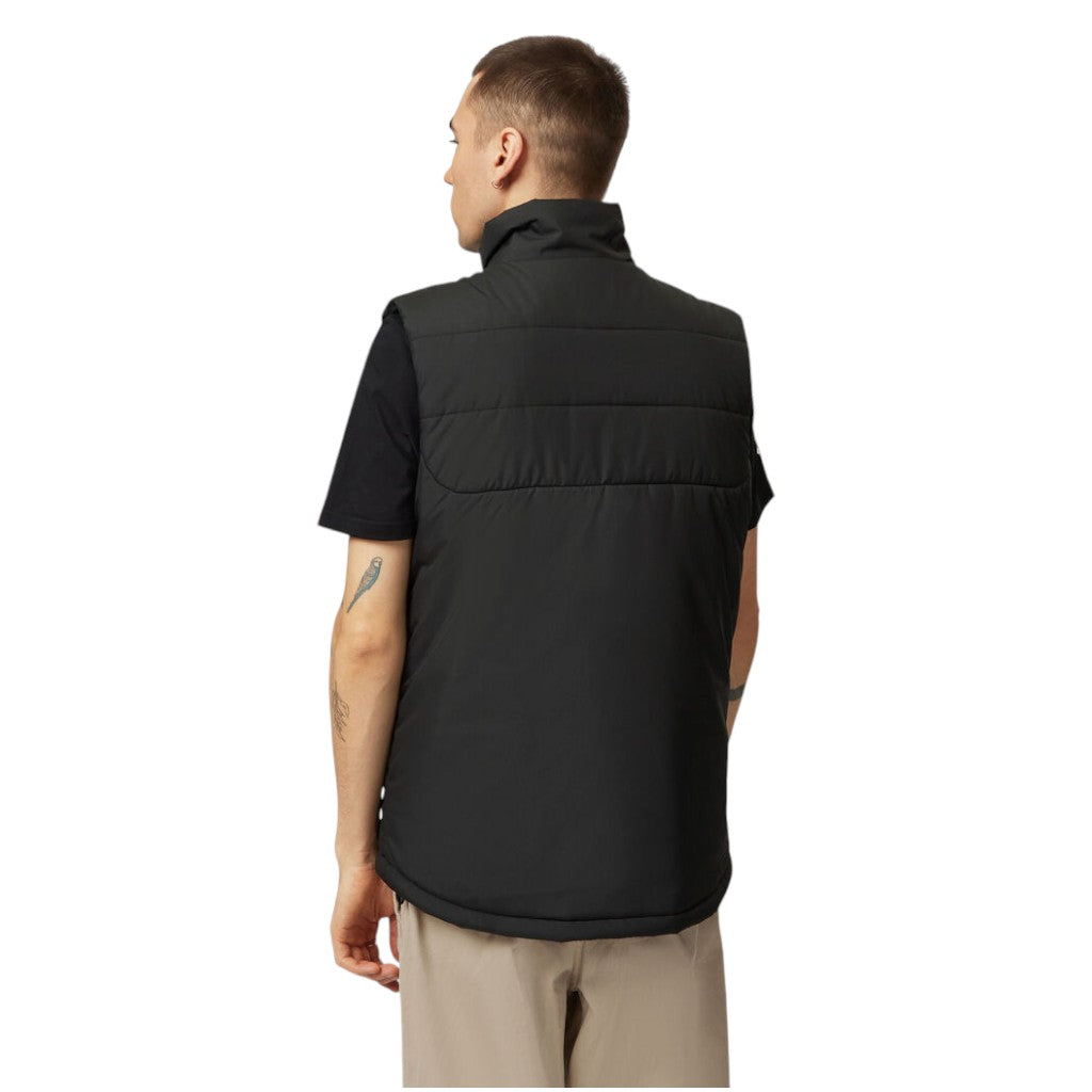 Person wearing a black vest on a white background