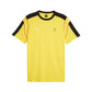 Yellow t-shirt with black sleeves and collar, featuring Puma and Ferrari logos on a white background.