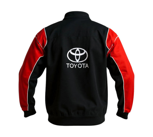 Blue and black jacket with Subaru Racing and Crossover Racewear logos on a white background