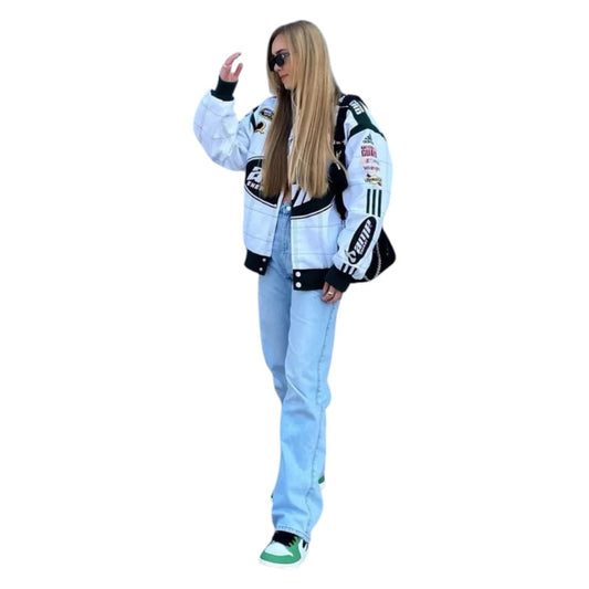 Person wearing a white racing suit with various logos on a white background