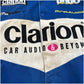 Close-up of a sports jersey with 'Clarion Car Audio & Beyond' branding.