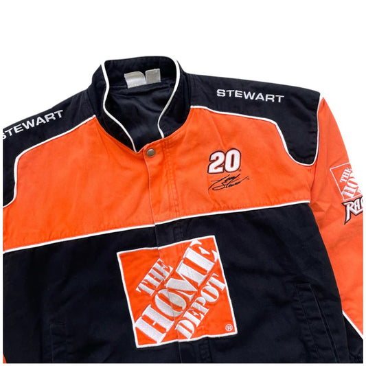 Orange and black jacket with 'Stewart' and 'The Home Depot' logos on a white background