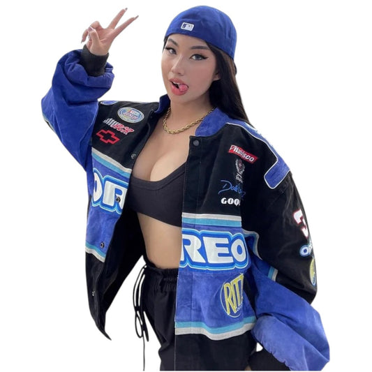 Person wearing a blue and black jacket with various logos on a white background
