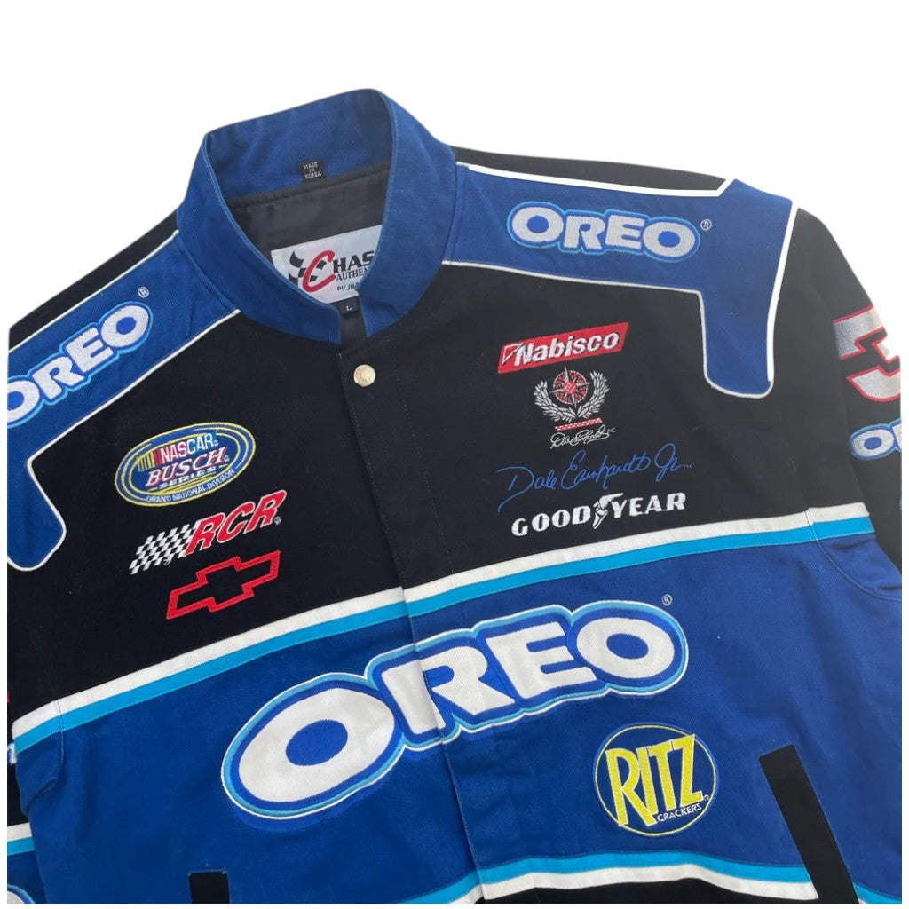 Blue and black racing jacket with various brand logos on a white background