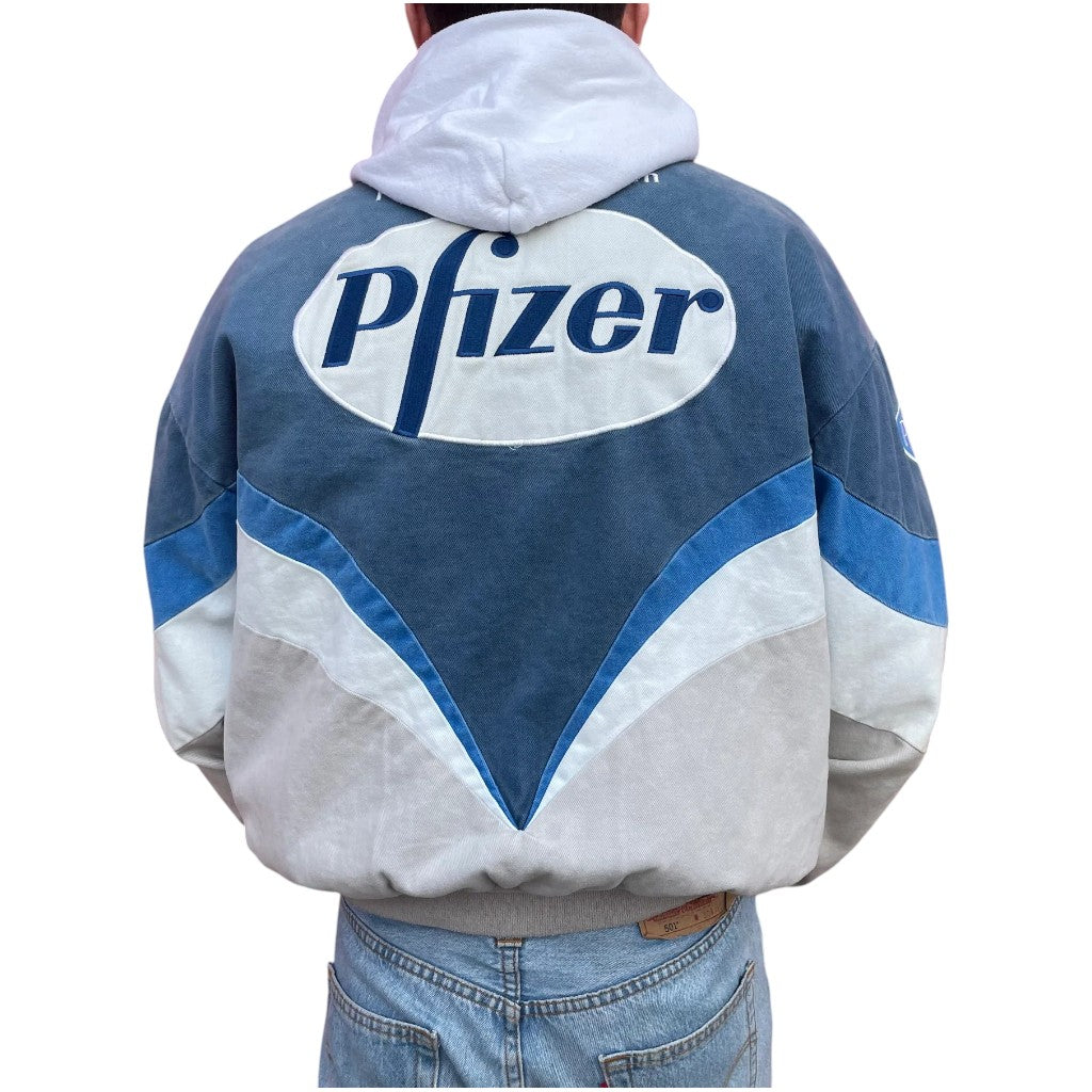 Person wearing a jacket with Pfizer logo on the back