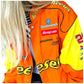 Orange and yellow racing jacket with various sponsor logos